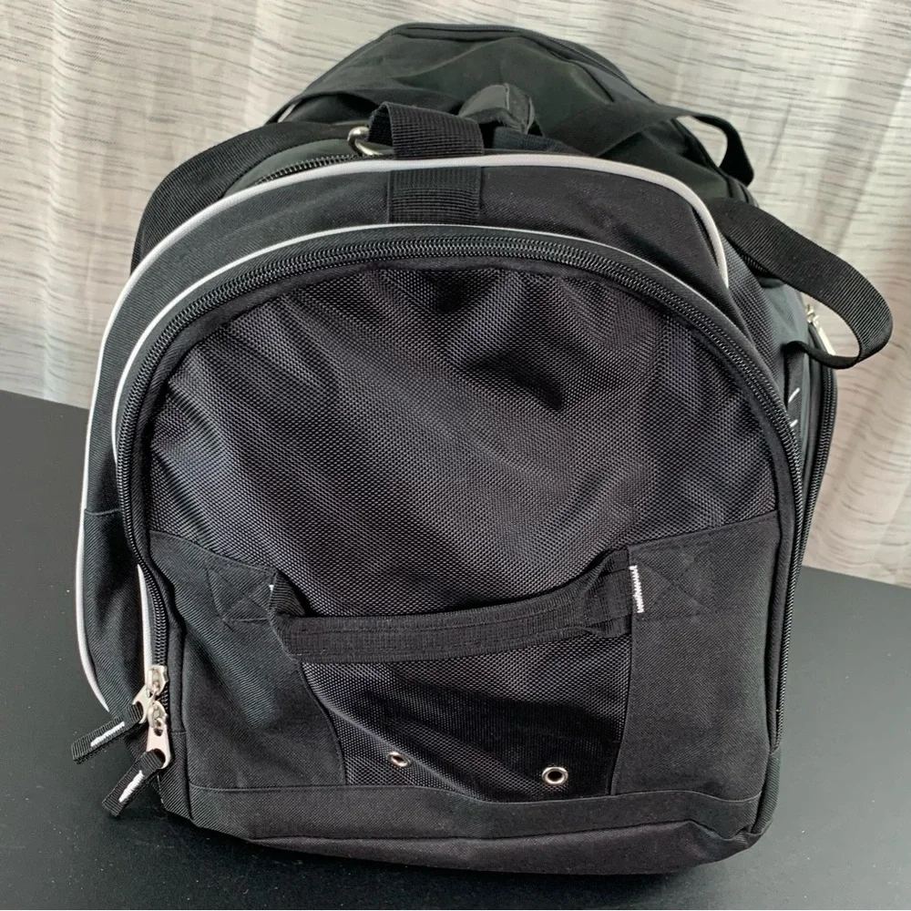 A Black 100th Anniversary Duffel Bag (Masonic?).
